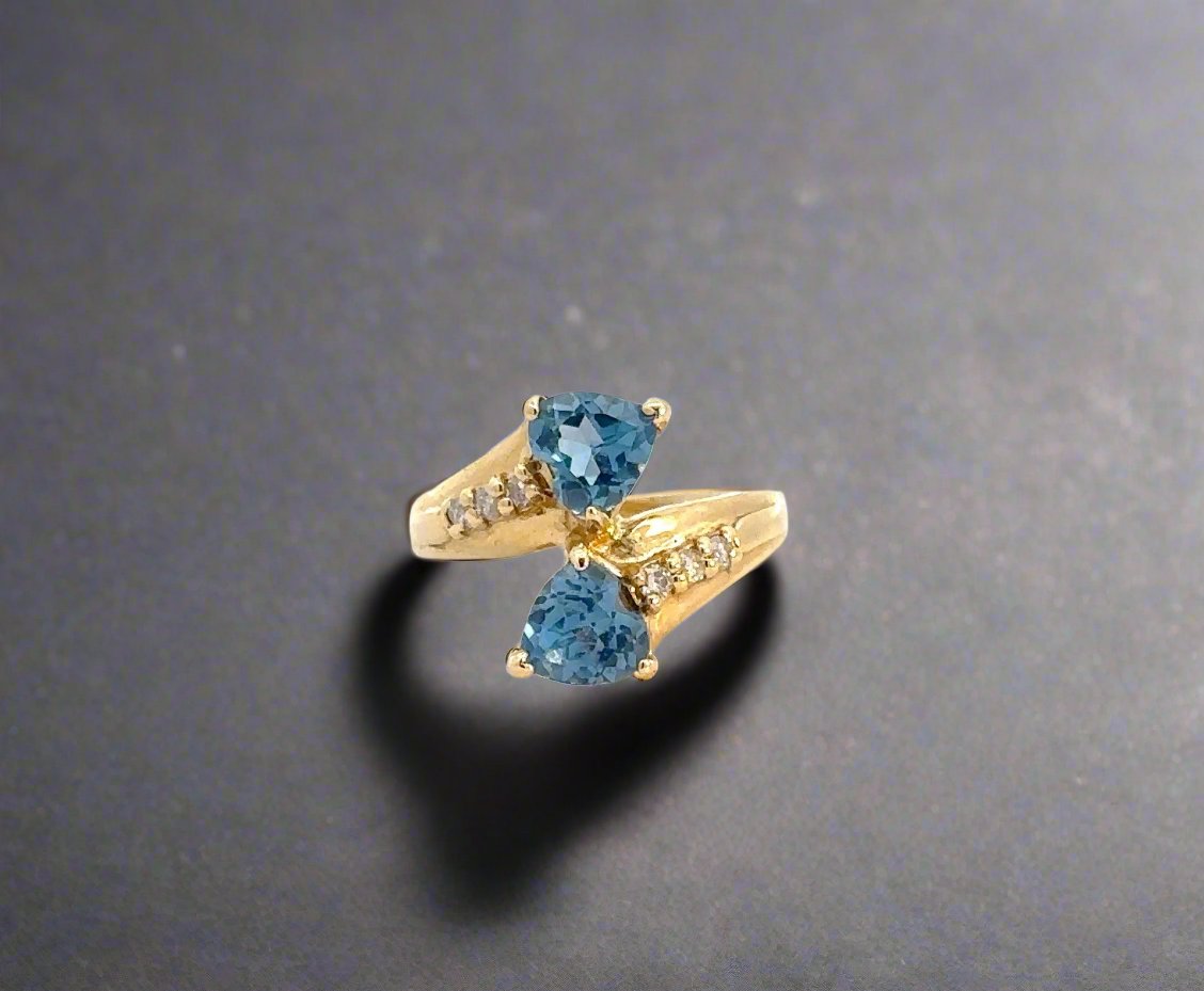Front of blue gemstone and diamond ring