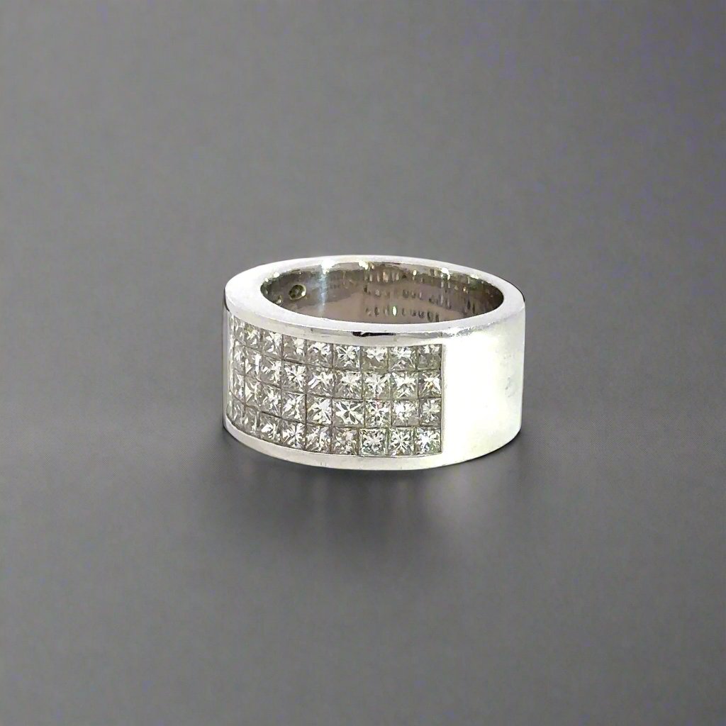 Diagonal view of diamond band ring with diamonds on half the band