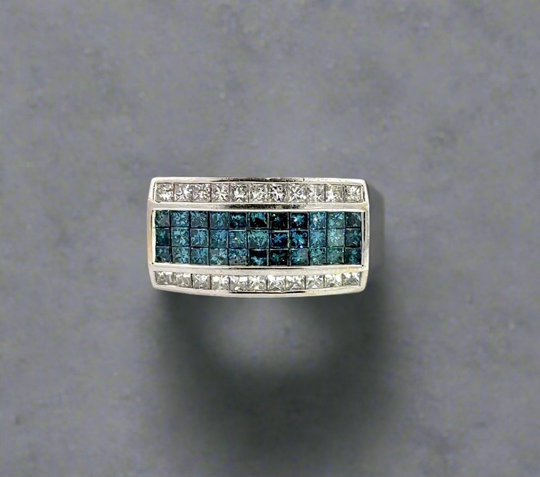 front of white gold ring with blue and white princess cut-diamonds on the front
