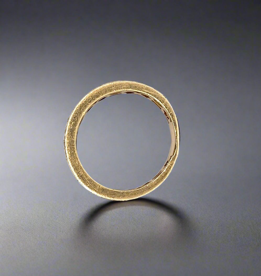 top of yellow gold ring with obvious scratches (can be polished once purchased)