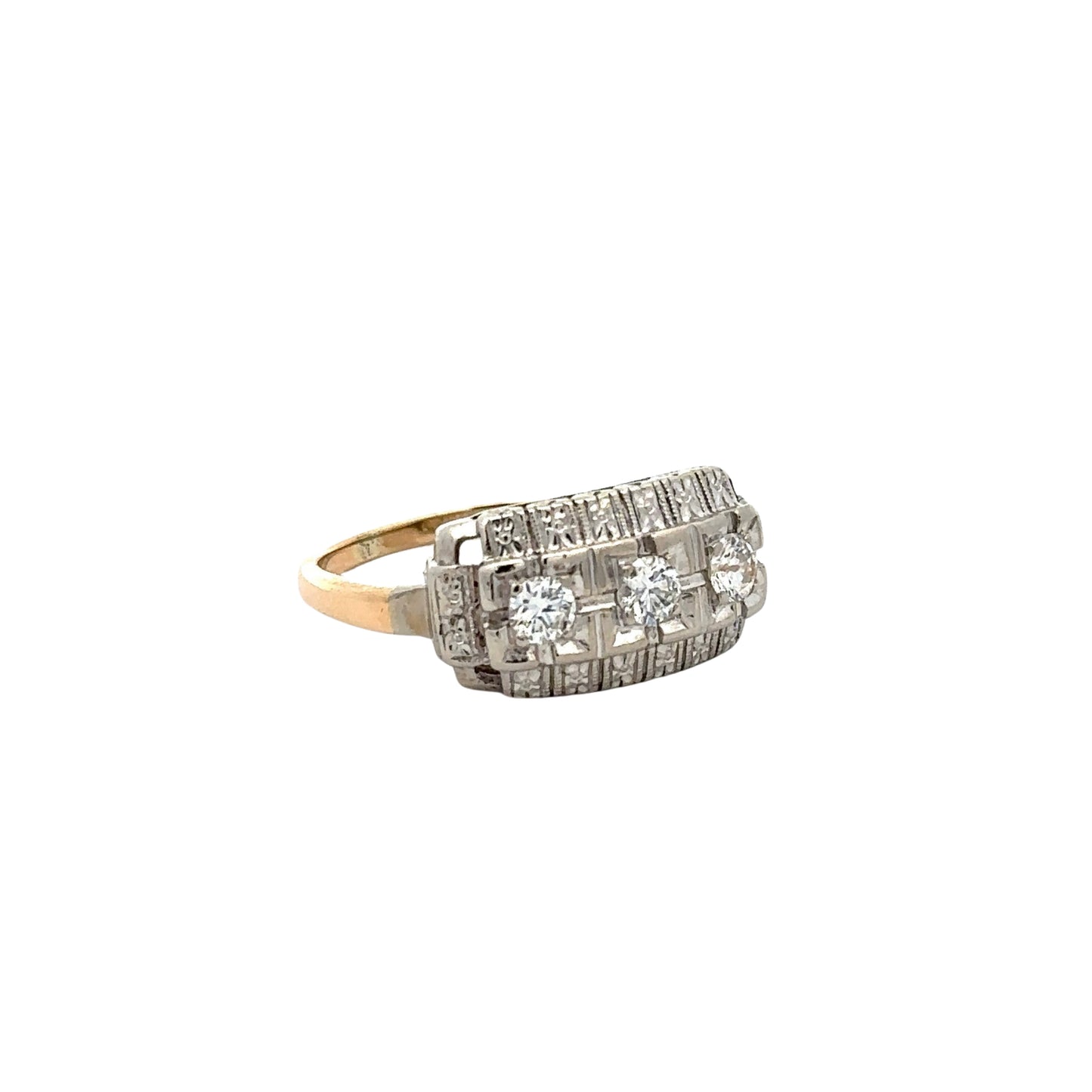 Diagonal view of white gold and yellow gold ring with 3 round diamonds