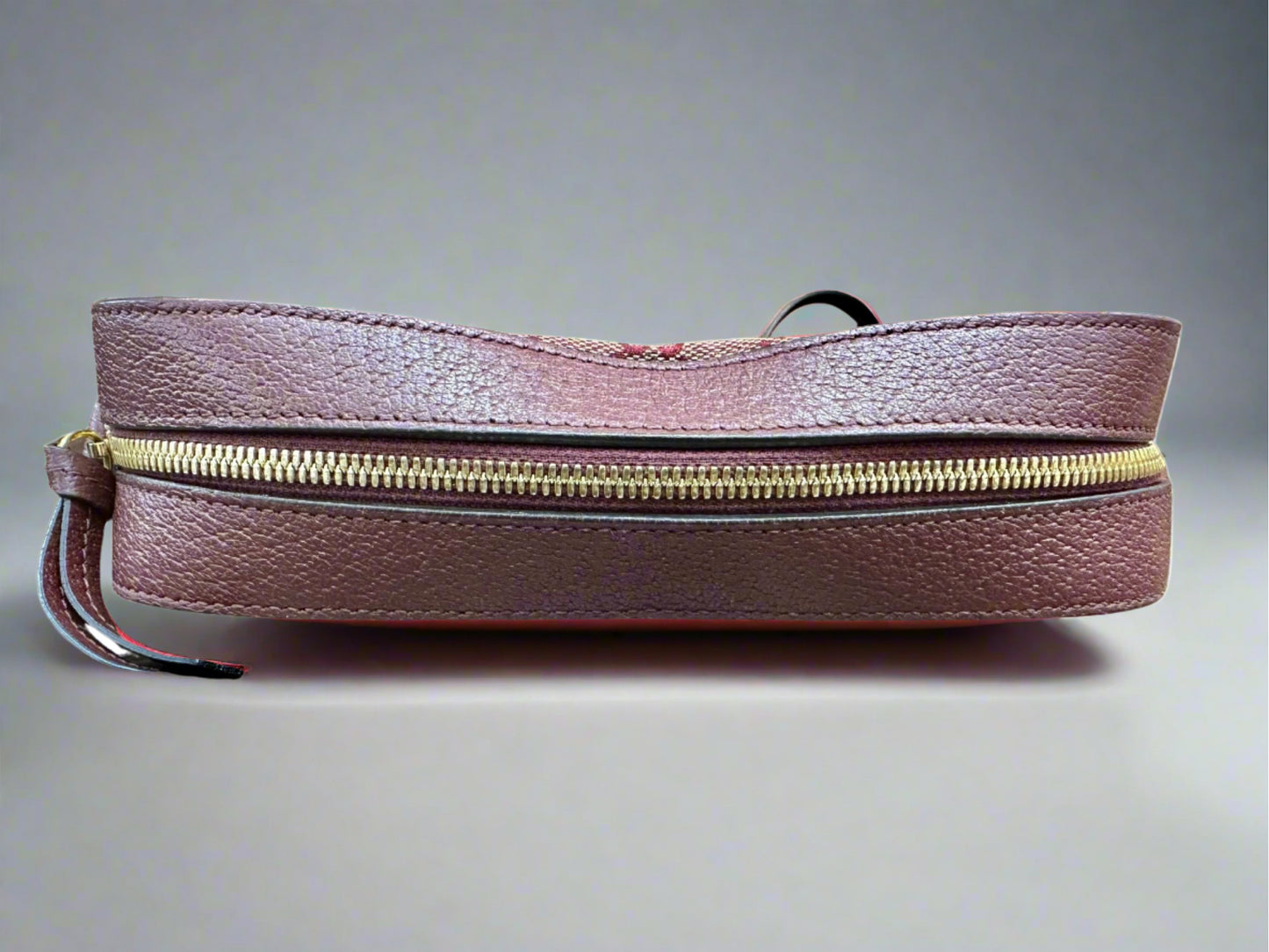 Top of bag with gold zipper