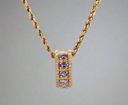 360 video of yellow gold rope chain and yellow gold diamond and gemstone pendant