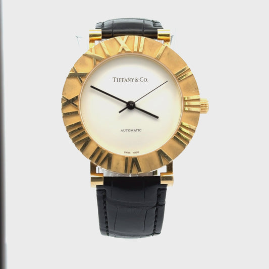 360 degree video of Tiffany & Co Atlas watch. Shows scratches on 18K yellow gold bezel and back of case and wear on the leather band.