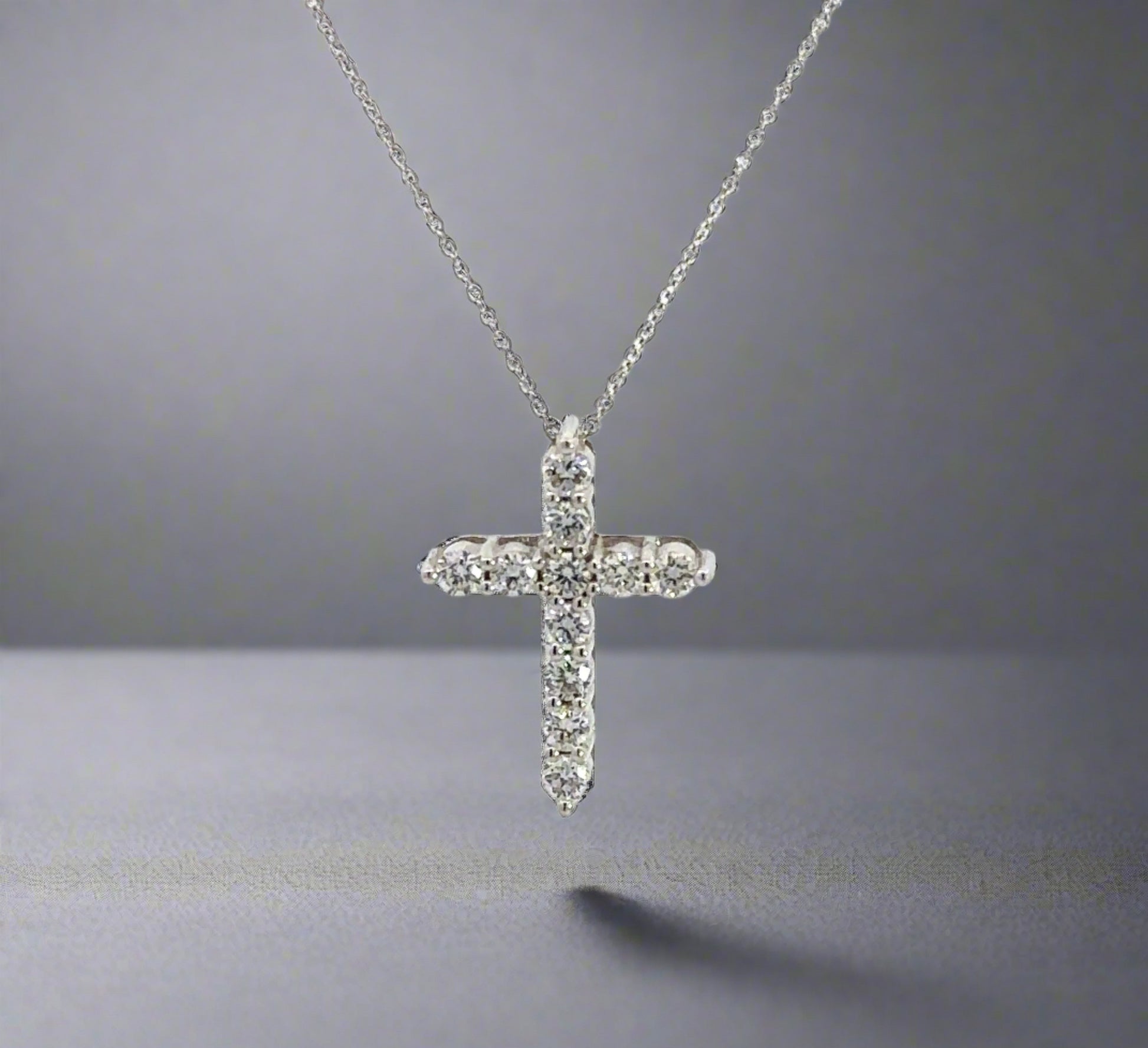 360 video of white gold diamond cross necklace