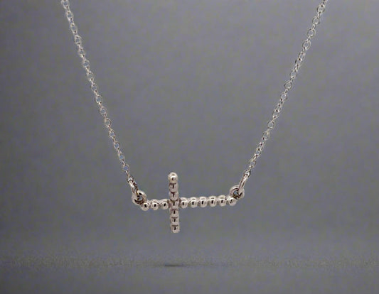 360 video of white gold cross necklace with beads