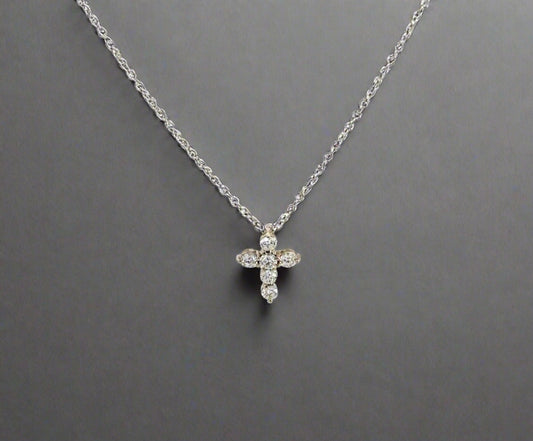 360 video of mini white gold diamond cross necklace