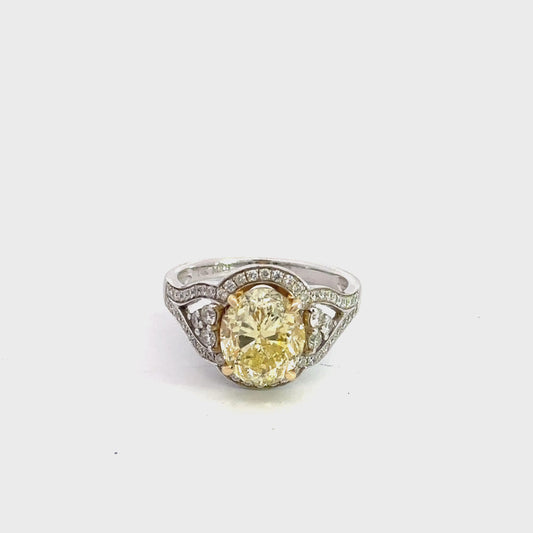 360 Video of white gold ring with yellow oval diamond in center and small round diamonds around center stone