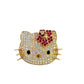 460 video of yellow gold hello kitty ring. There are small round diamonds on the face, dark pink stones on the hair pin, 2 black eyes, and a yellowish-orange gemstone for the nose.