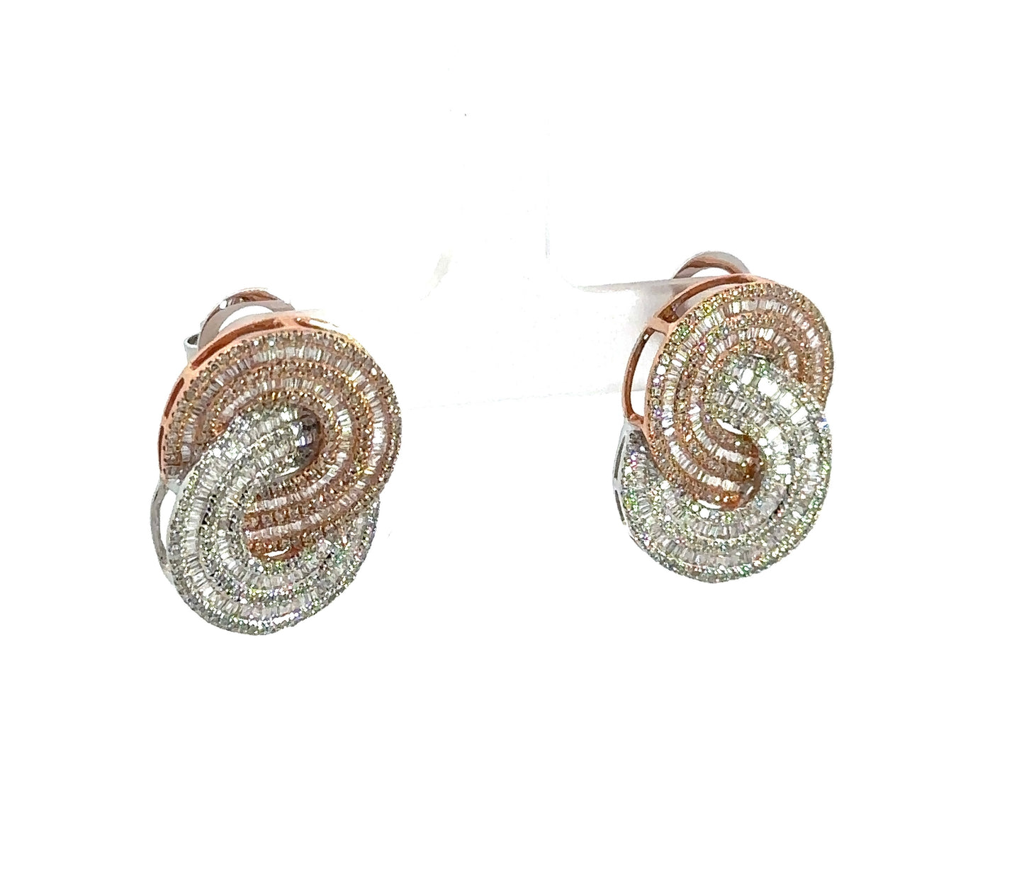 Diagonal view of rose and white gold diamond infinity earrings