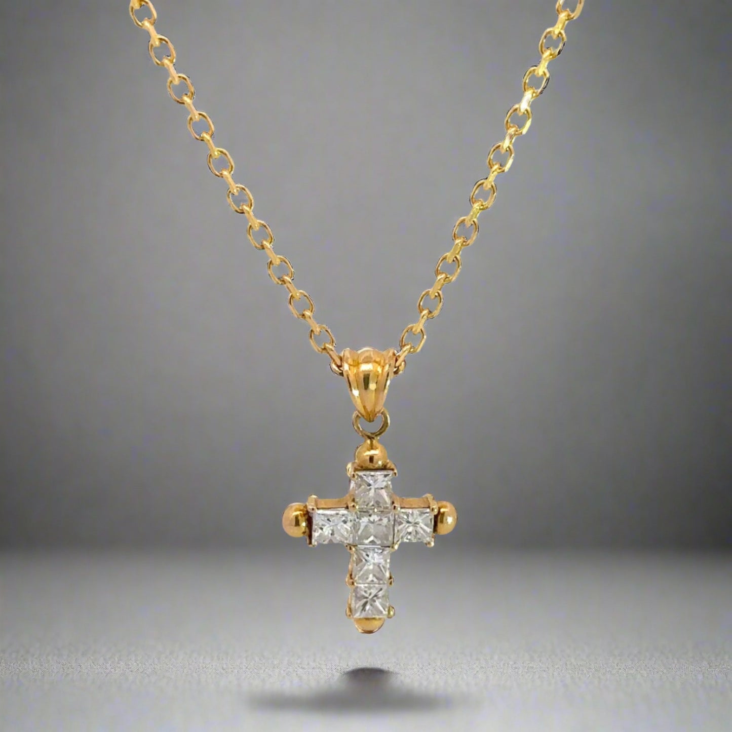 Front of princess-cut diamond cross necklace with 6 princess-cut diamonds