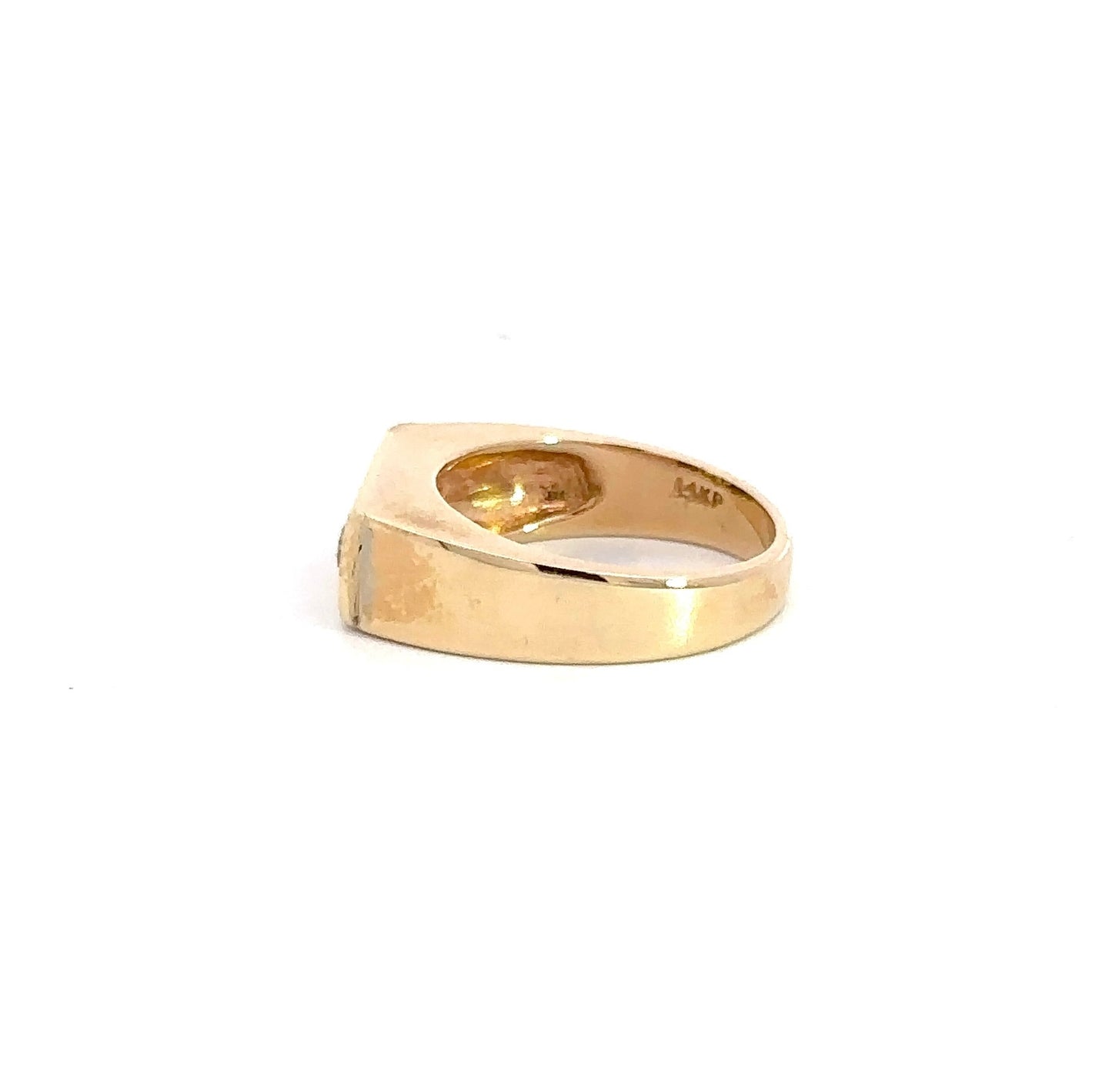 side of yellow gold ring with scratches on the band and 14K stamp on the inside