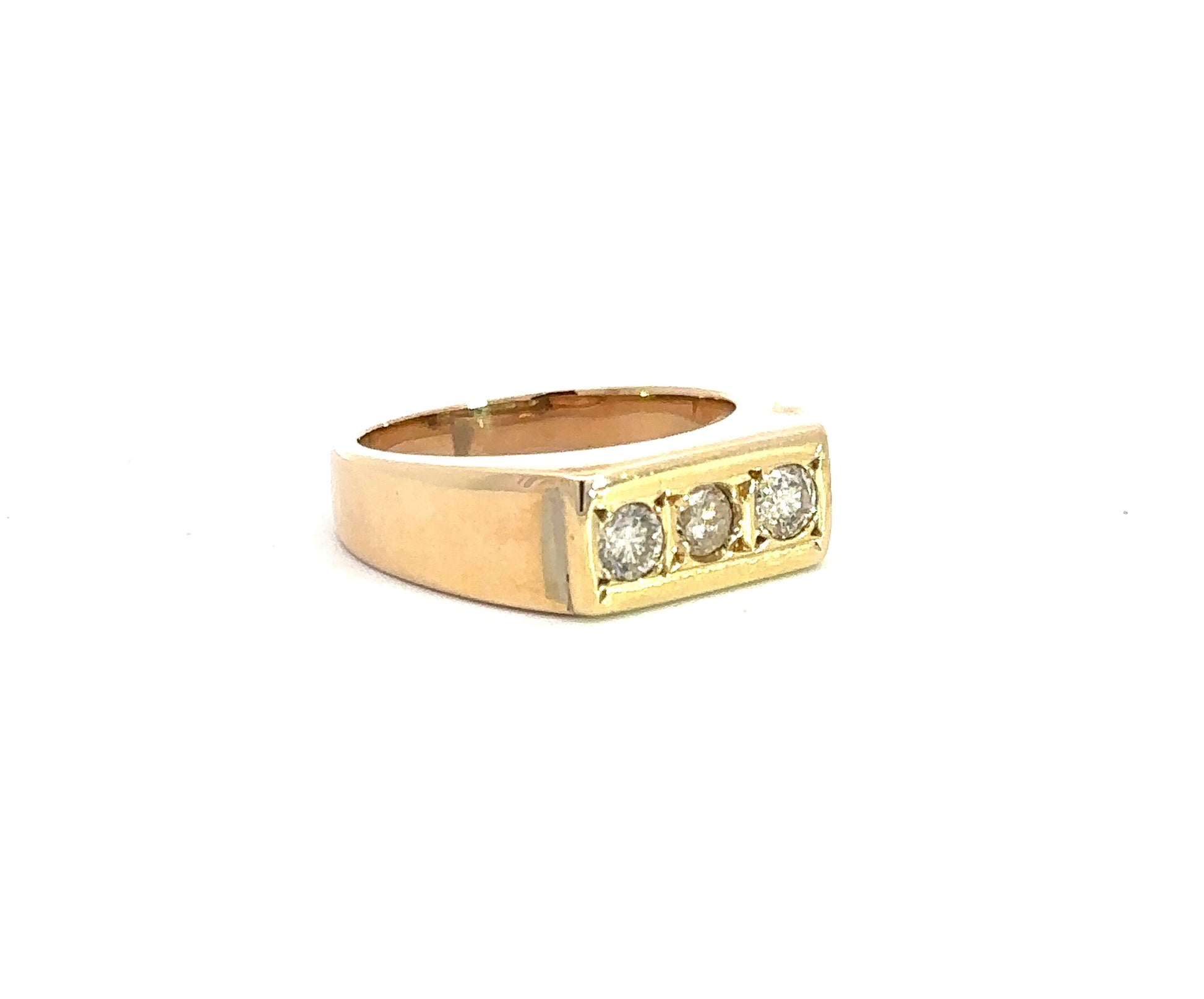 diagonal view of yellow gold band ring with 3 small round diamonds