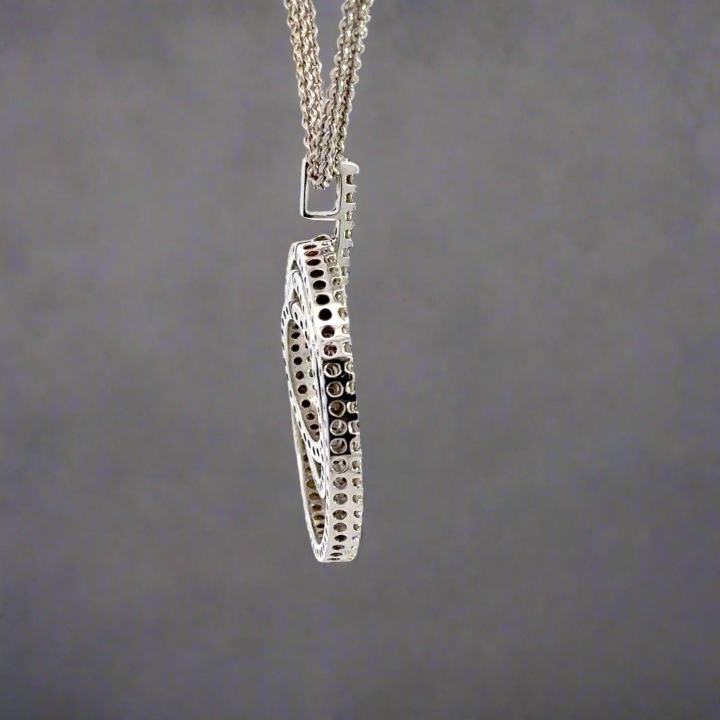 Side of white gold necklace with square bail