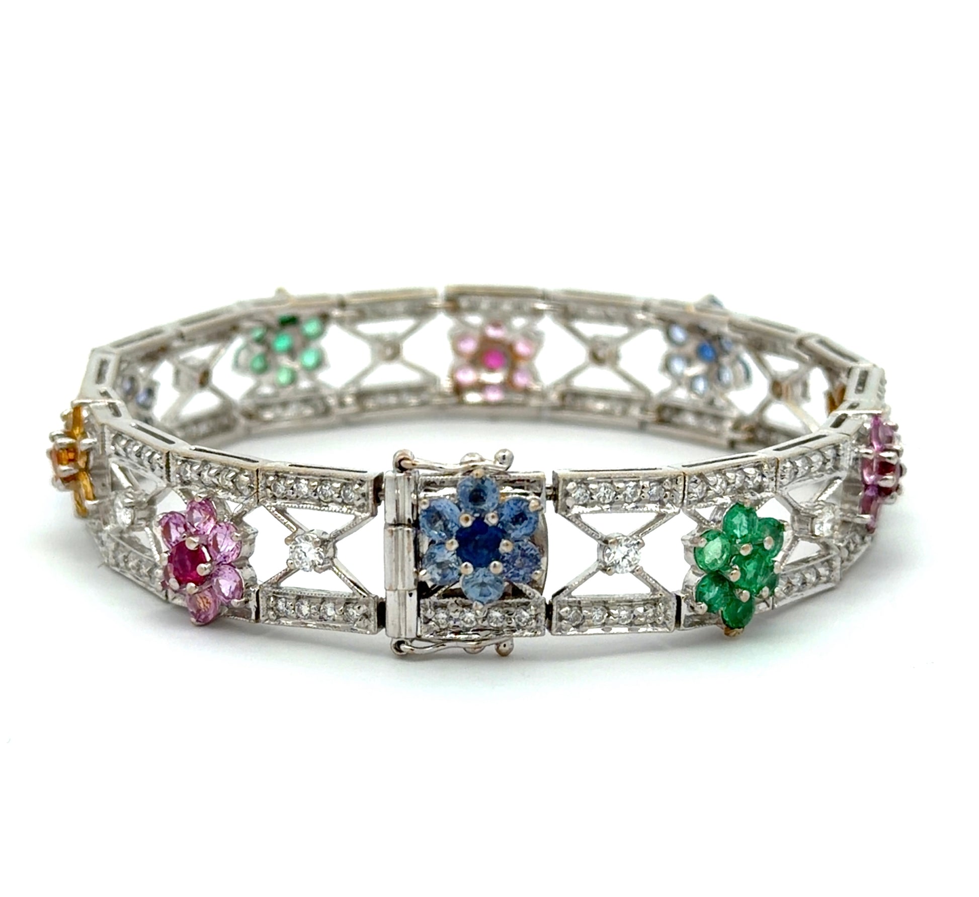 White gold bracelet with gemstones and diamonds on a white background