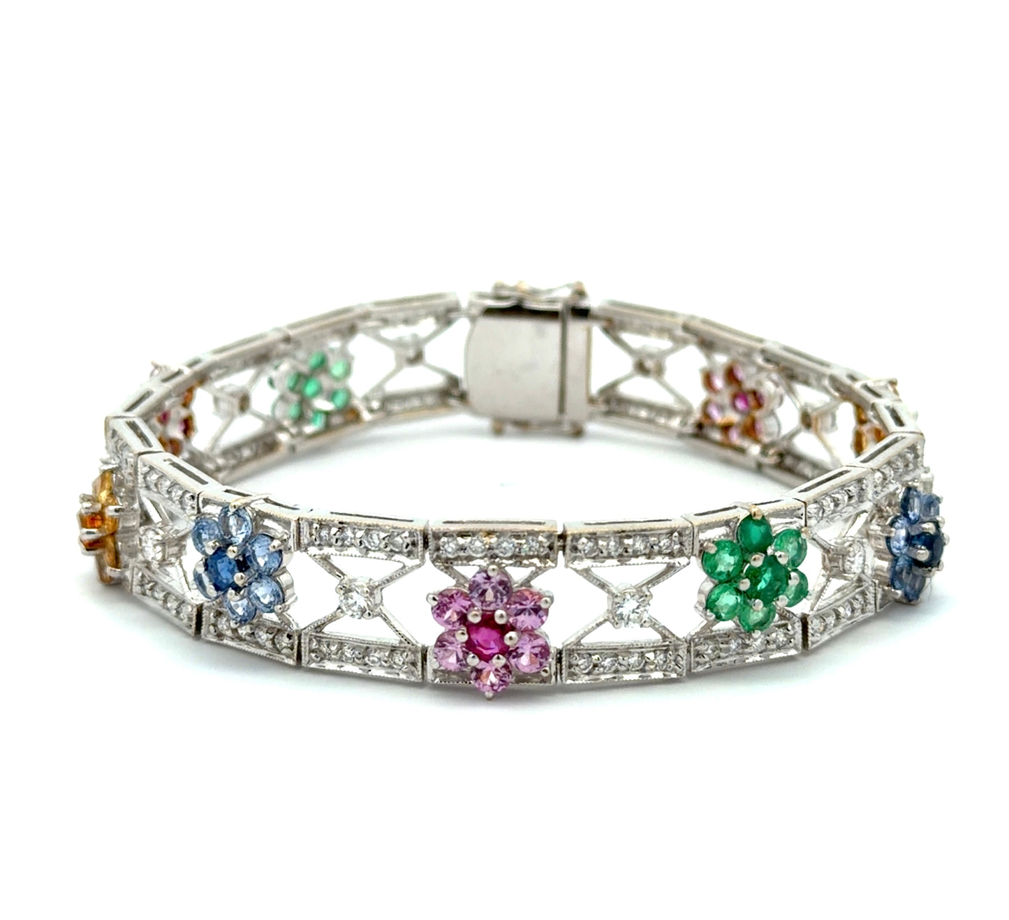 White gold bracelet with colorful gemstones and diamonds n a white background