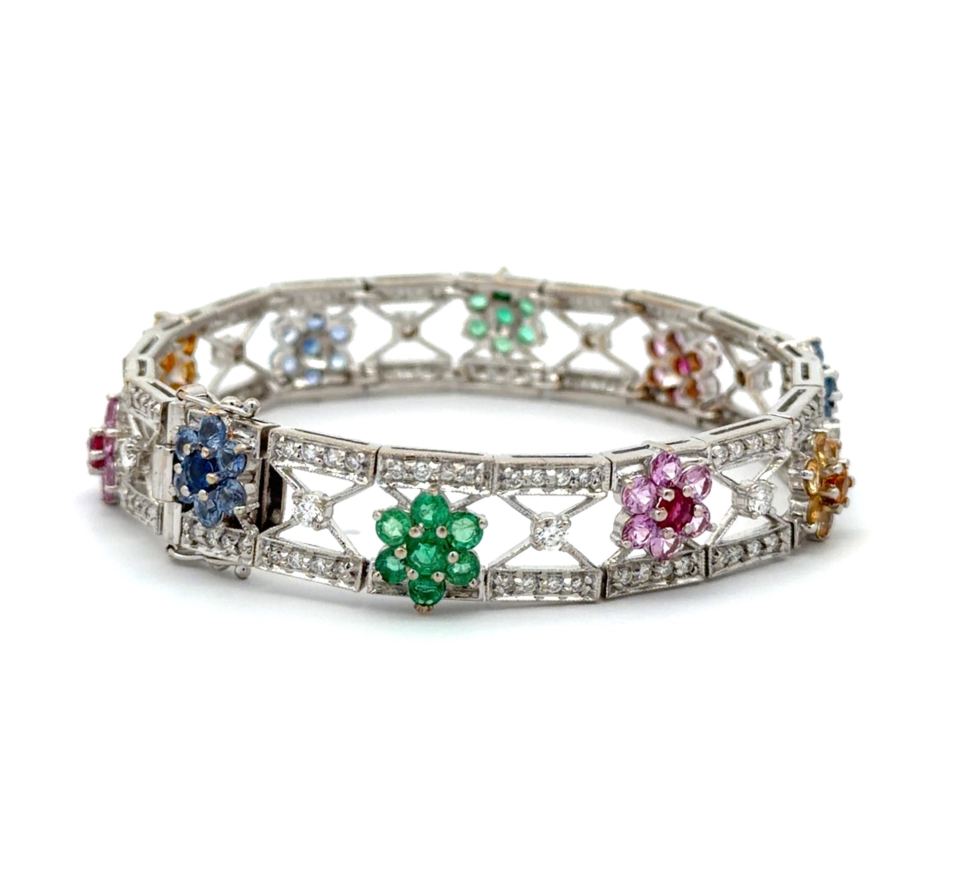 White gold bracelet with gemstones and diamonds on a white background