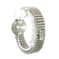 Diagonal back of diamond watch in white gold with rows of 5 round diamonds throughout the band