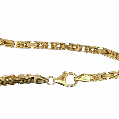 Detailed view of 14K yellow gold fancy link necklace showing lobster clasp and 14K hallmarks