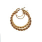 side of rope-style yellow gold hoops