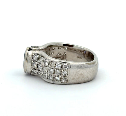 White gold ring with a Tanzanite oval gemstone and diamond accents on a white background