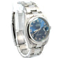 Diagonal view of rolex with blue roman numeral face and stainless steel case and band.