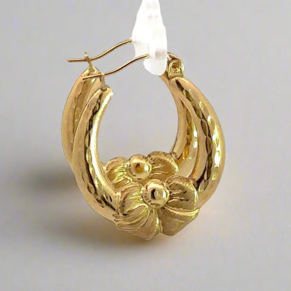 Side of yellow gold bow hoops