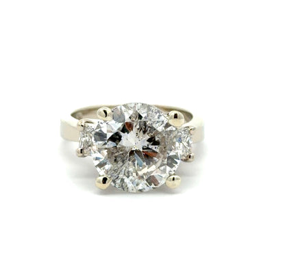 3 stone diamond ring on white background