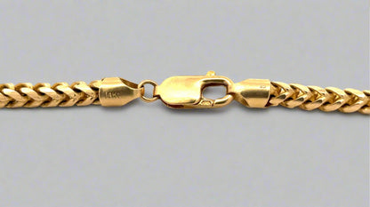 Close up of lobster clasp with 14K stamp