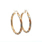 Diagonal front of tri-color gold hoops