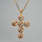 Back of cross necklace with white and yellow gold