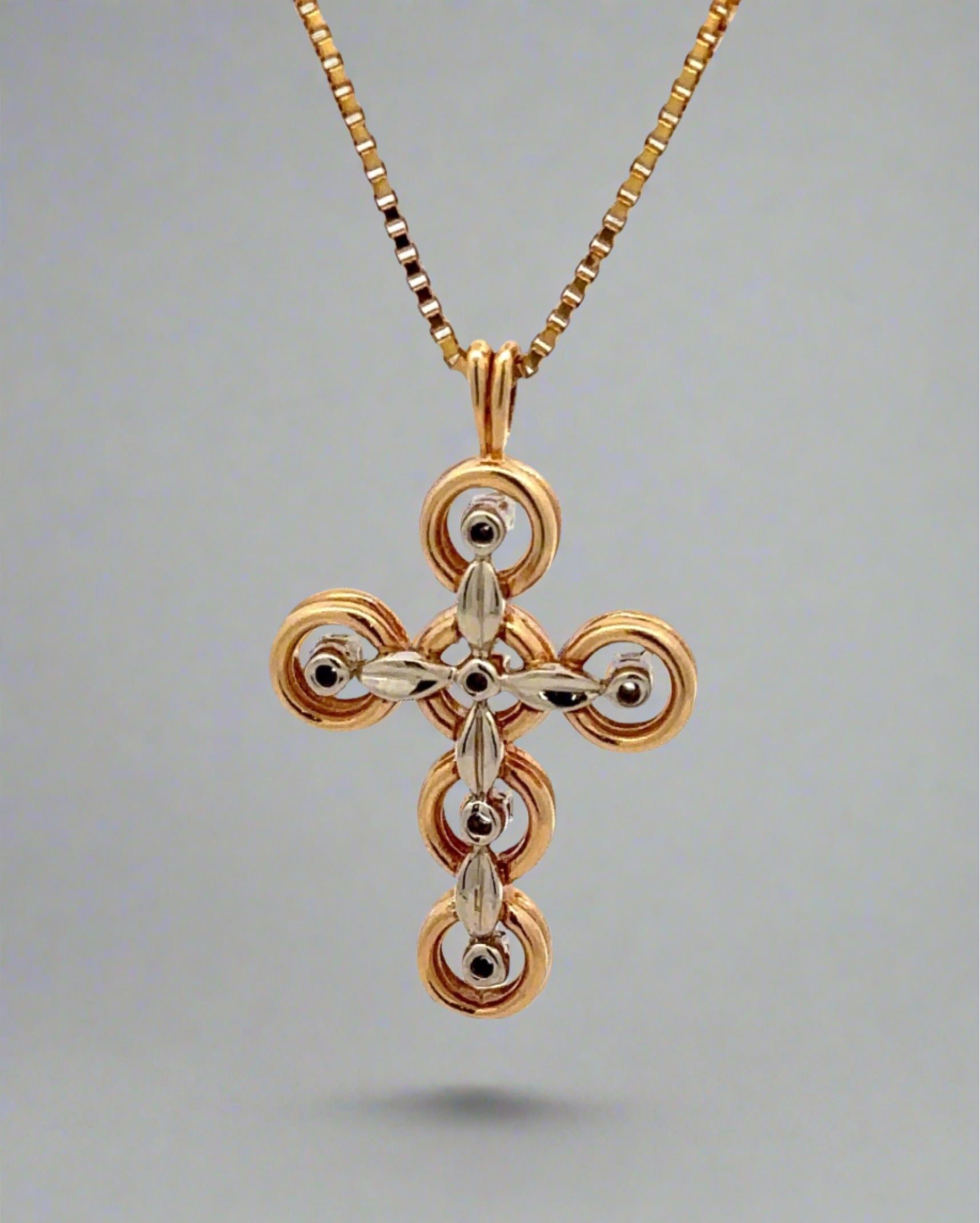 Back of cross necklace with white and yellow gold