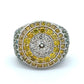 White gold ring with yellow, white, blue, & green diamonds on a white background