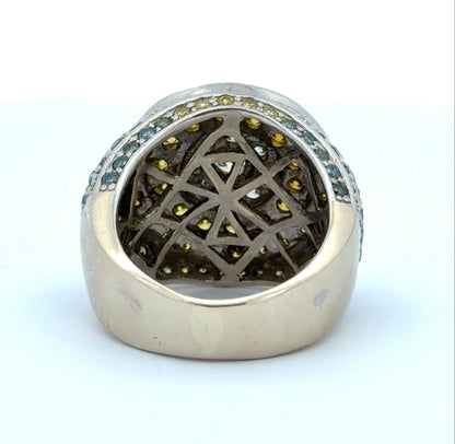 Back of white gold ring with yellow, white, blue, & green diamonds on a white background