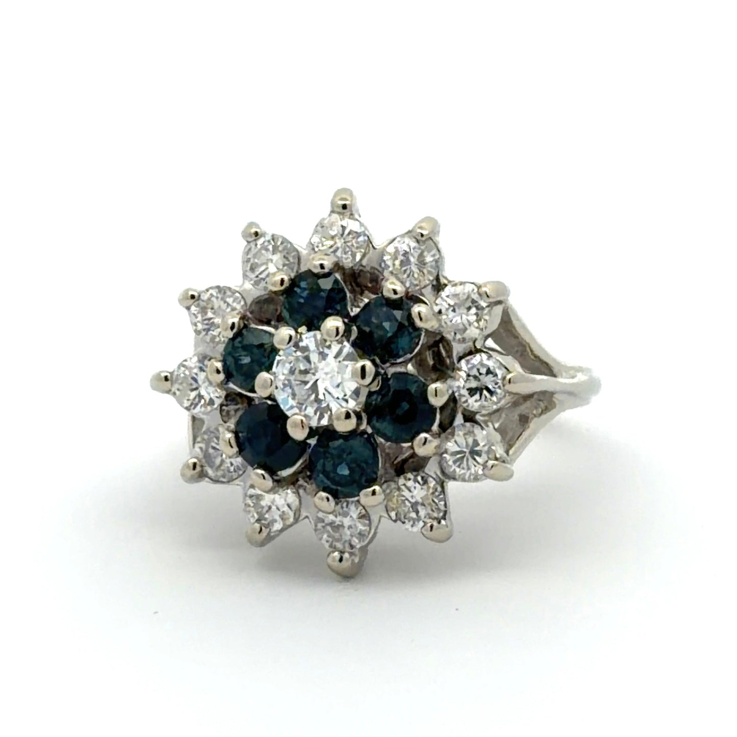 White gold ring with blue gemstones and diamonds on a white background