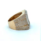 Gold ring with diamond accents on a white background