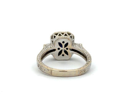 White gold ring with a design on the gold