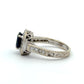 White gold ring with intricate design and diamonds
