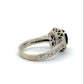 Back of white gold ring with intricate design on gold