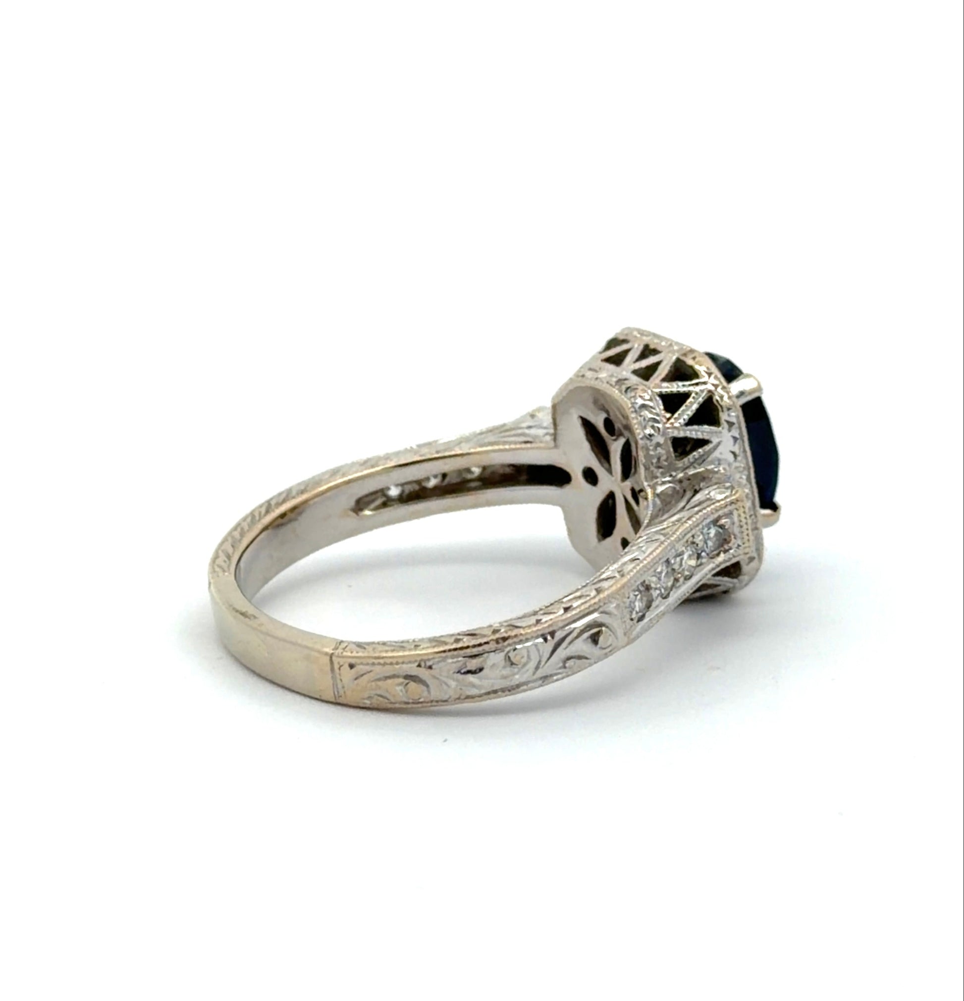 Back of white gold ring with intricate design on gold