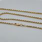 Gold chain necklace on a white background