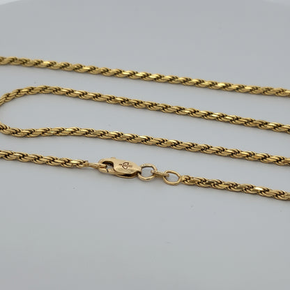 Gold chain necklace on a white background