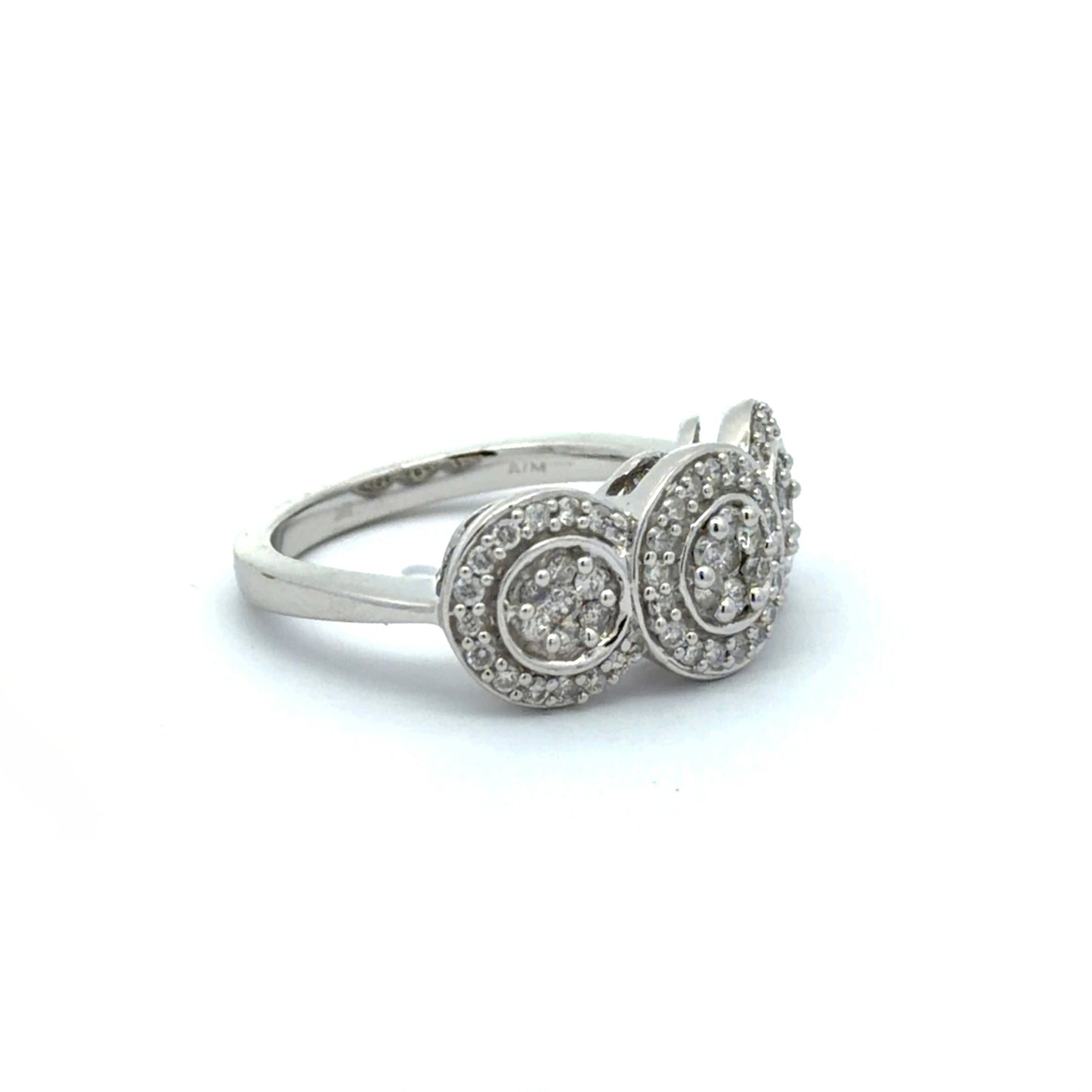 White gold ring with three circular diamond settings on a white background