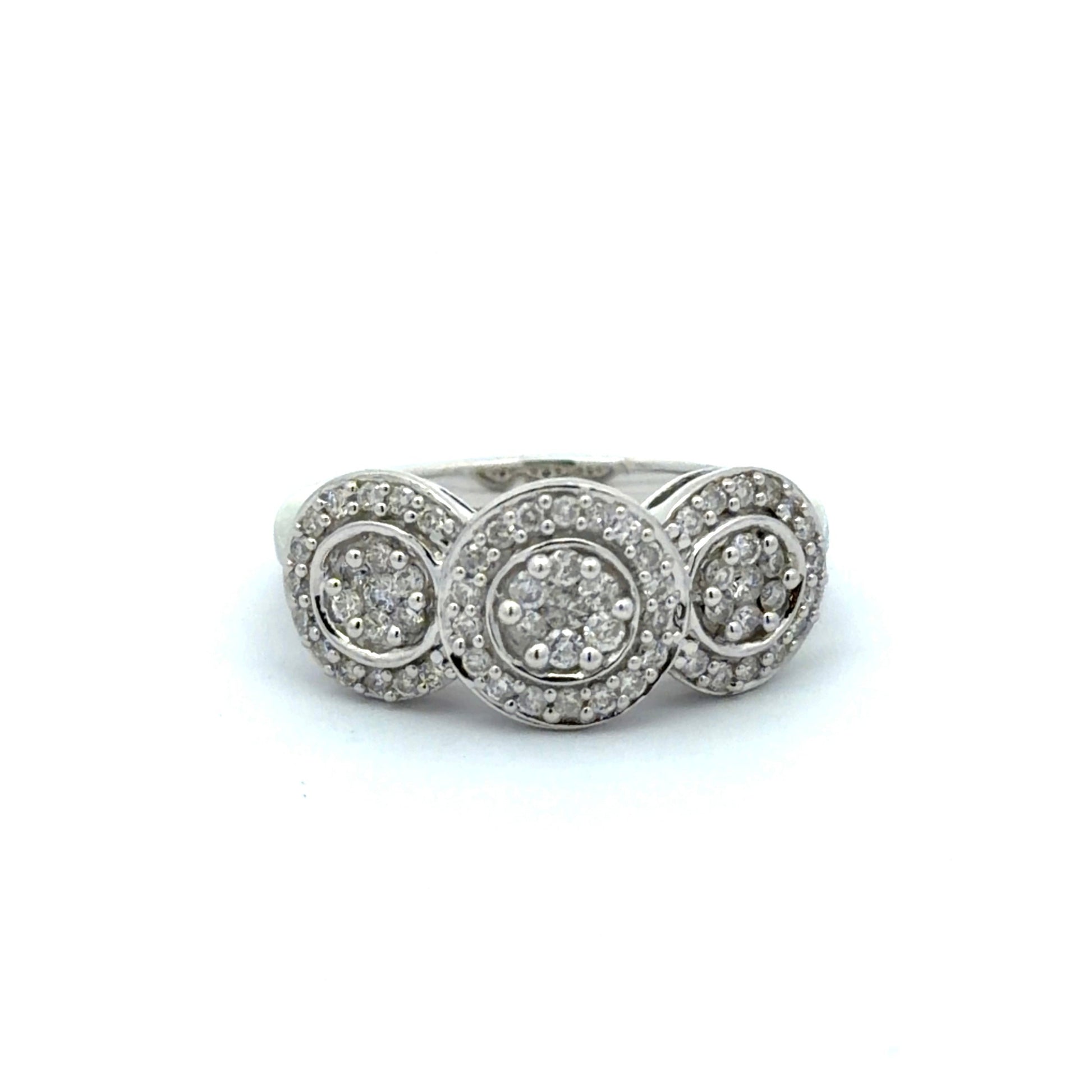White gold ring with three circular diamond settings on a white background