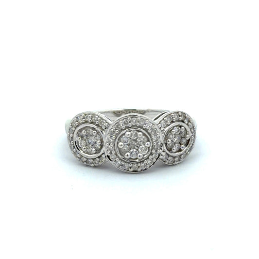 White gold ring with three circular diamond settings on a white background