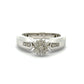 White gold ring with a diamond flower design on a white background