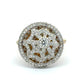 Diamond-encrusted ring with intricate design on a white background