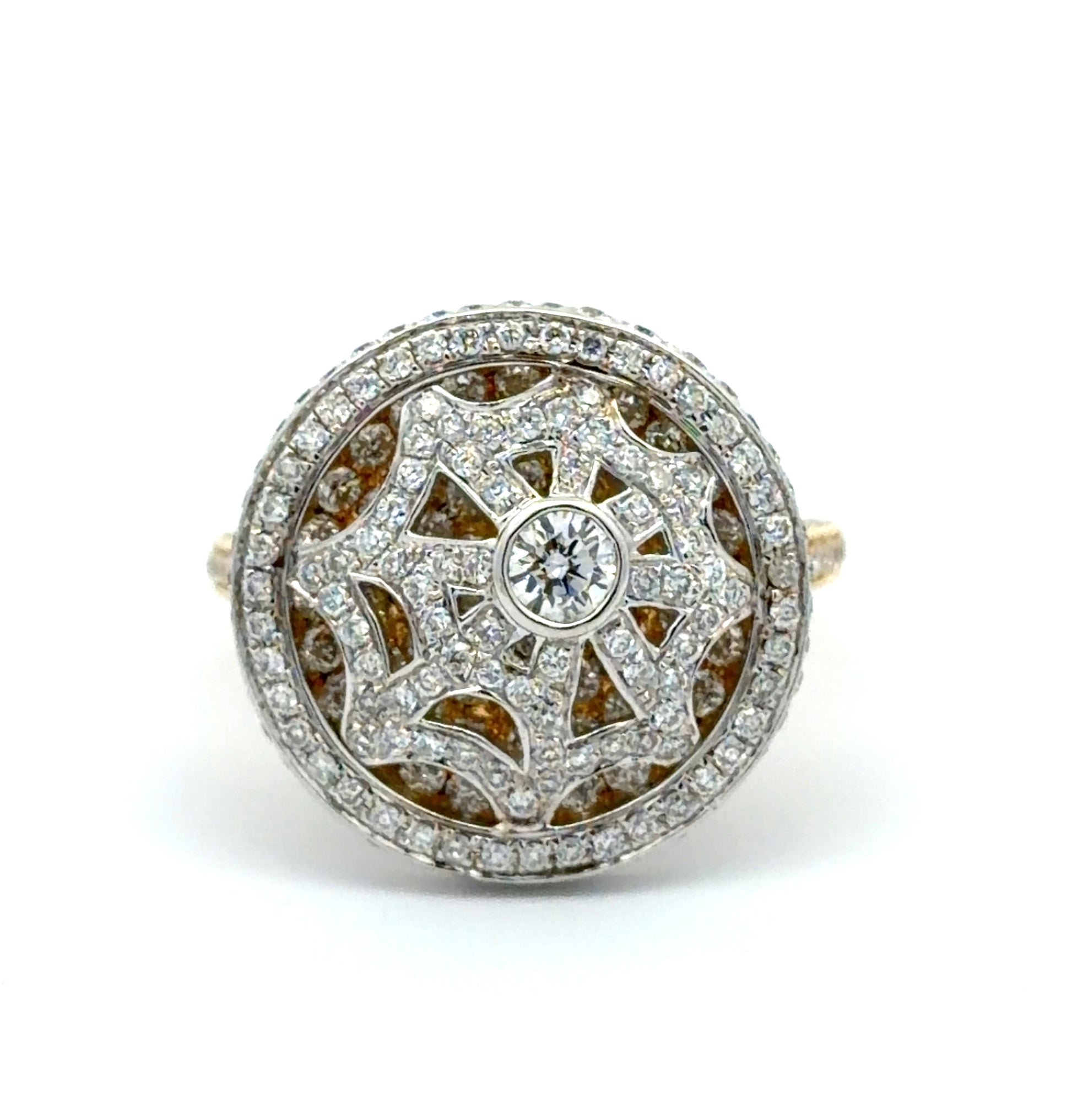 Diamond-encrusted ring with intricate design on a white background