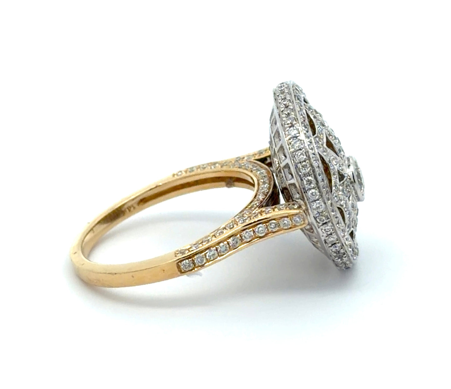 Gold ring with diamond pavé on a white background