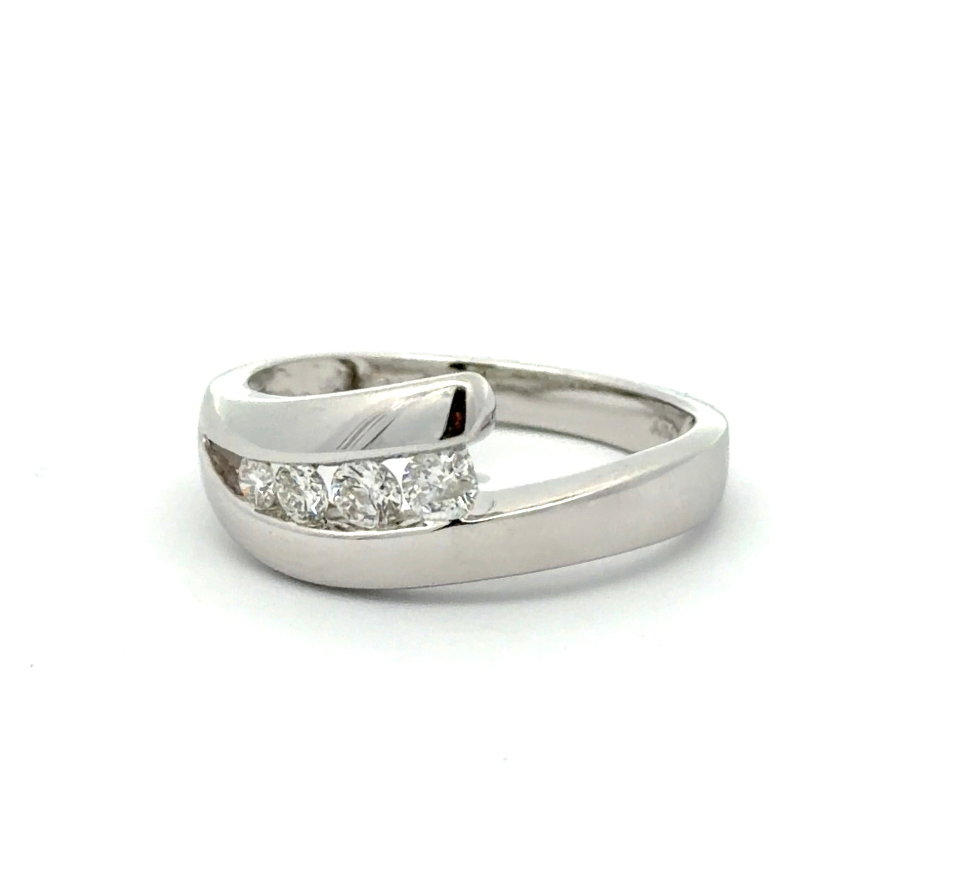 Diagonal view of white gold ring with 4 natural round diamonds on a white background